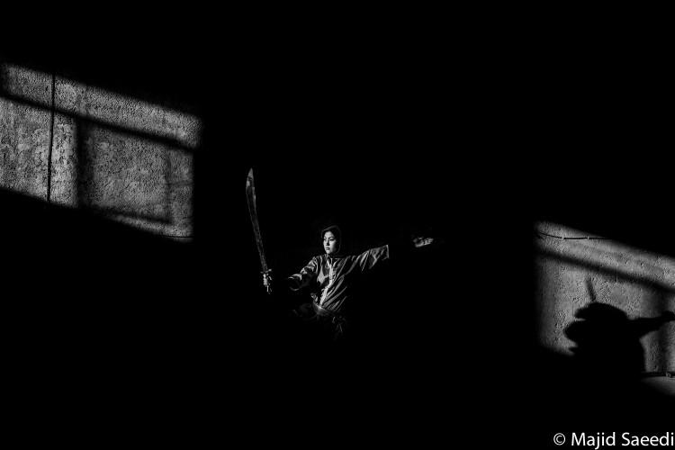 An Afghan girl practice Vosho in a gym in Herat, Afghanistan