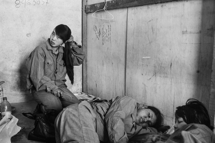 Kachin Independence Army female recruits rest in between drills.